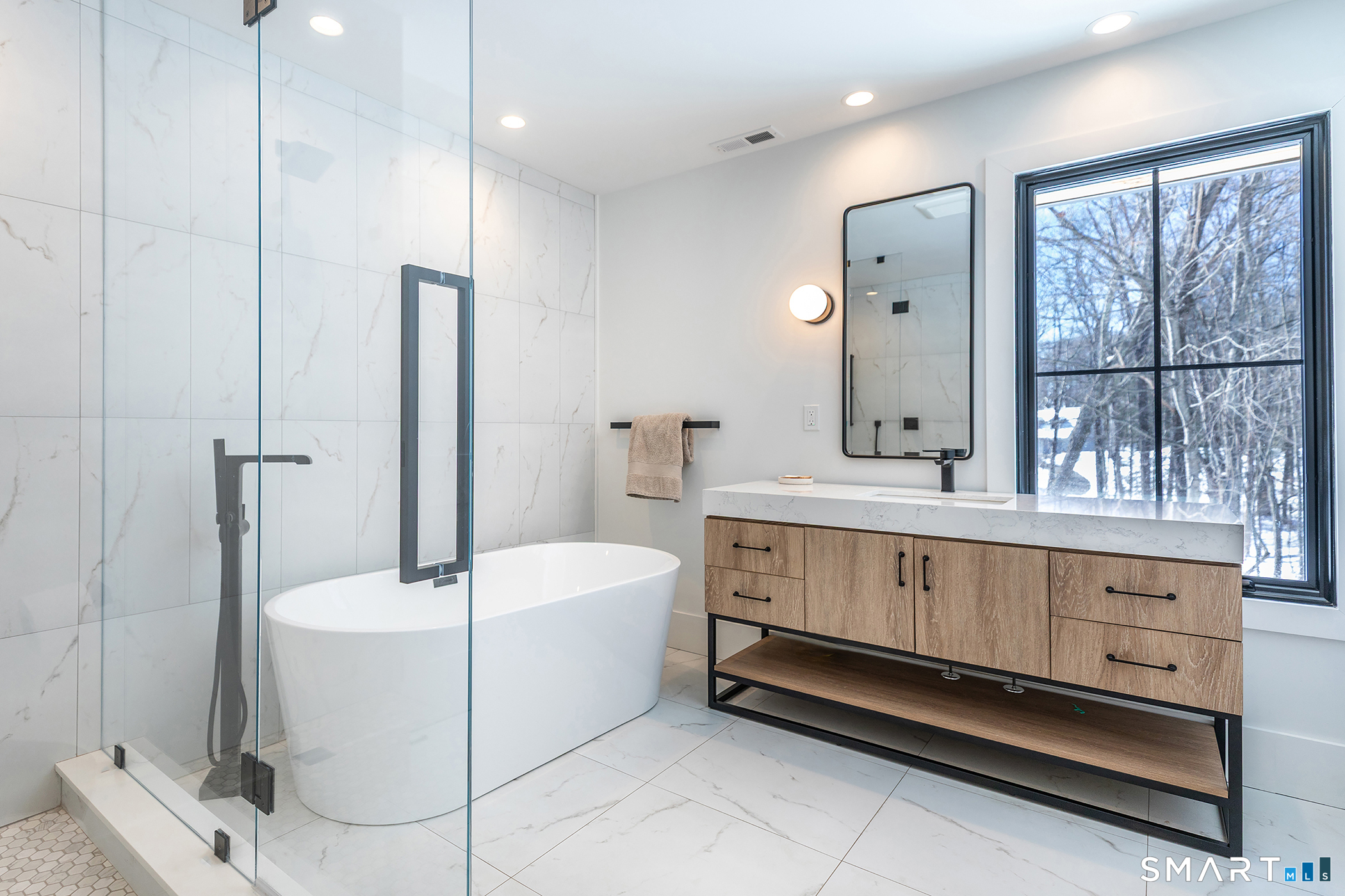 45 Chalybes Road Roxbury, CT 06783 - Photo 14 of 33 a bathroom with a sink a mirror and a bathtub