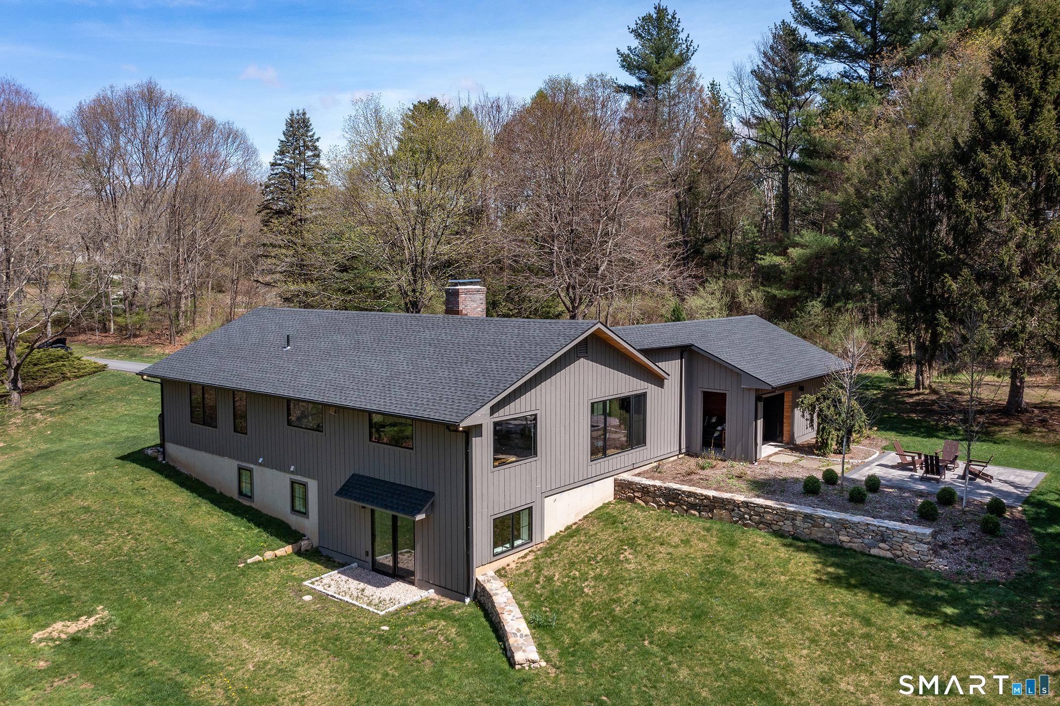45 Chalybes Road Roxbury, CT 06783 - Photo 2 of 33 a aerial view of a house with swimming pool and trees in the background
