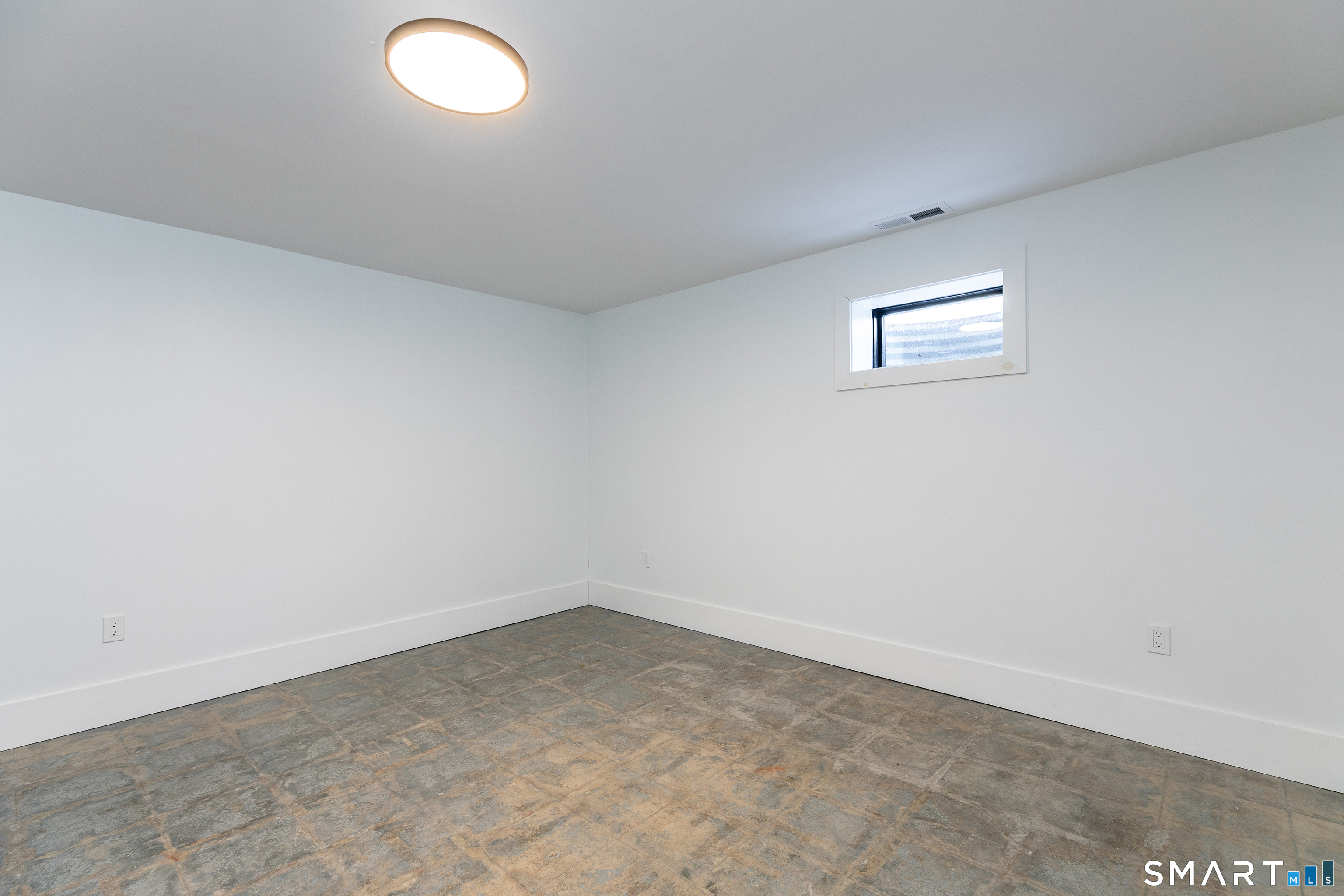 45 Chalybes Road Roxbury, CT 06783 - Photo 23 of 33 an empty room with a workbench