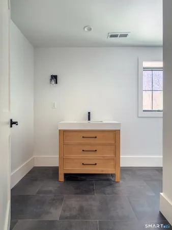 a view of room that has a dresser