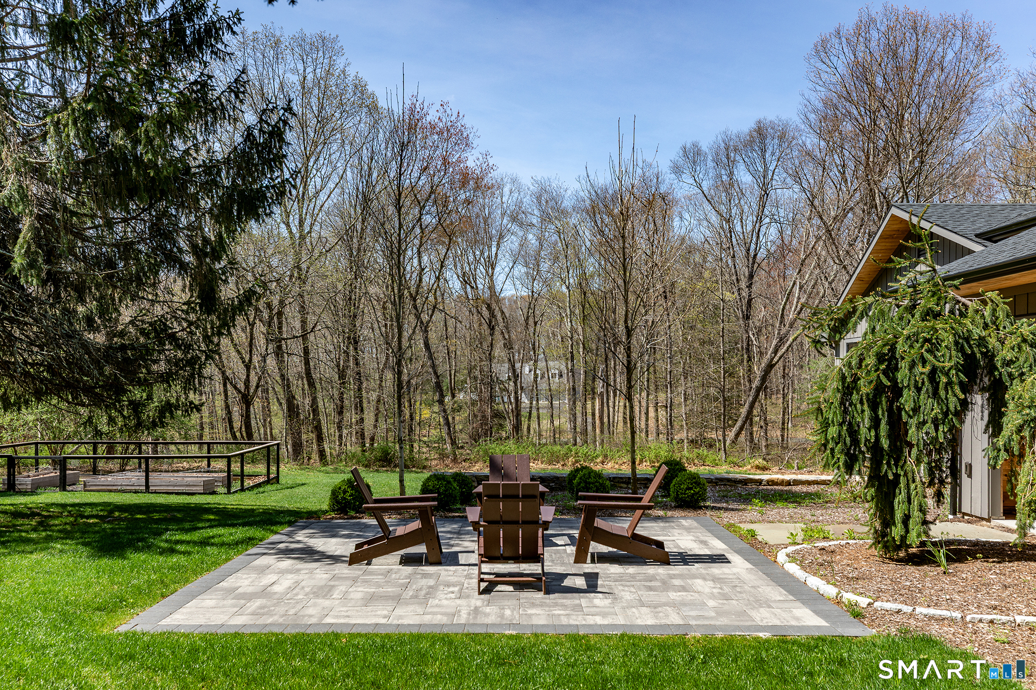 45 Chalybes Road Roxbury, CT 06783 - Photo 3 of 33 a view of a patio with table and chairs under an umbrella