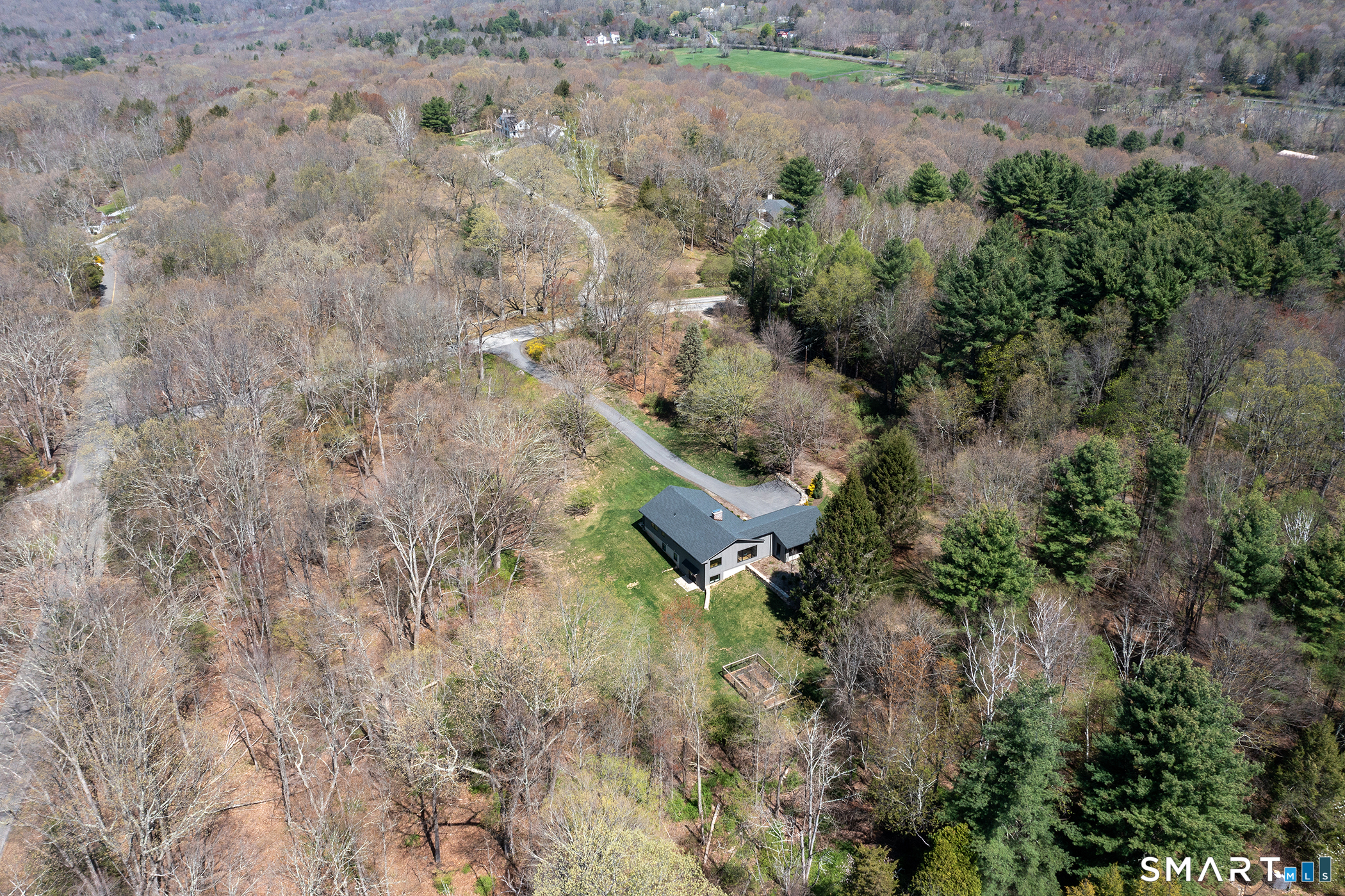 45 Chalybes Road Roxbury, CT 06783 - Photo 32 of 33 a aerial view of house with yard and outdoor seating