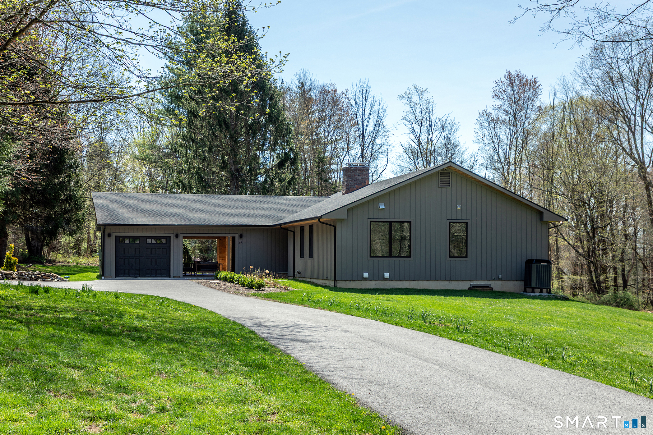 45 Chalybes Road Roxbury, CT 06783 - Photo 33 of 33 a house view with a sitting space and garden