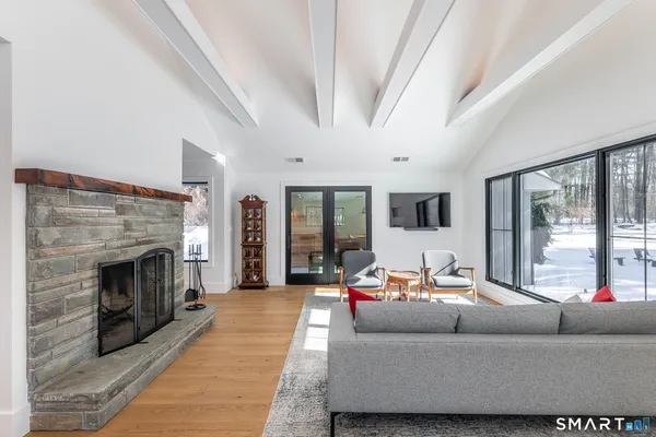 a living room with furniture and a fireplace