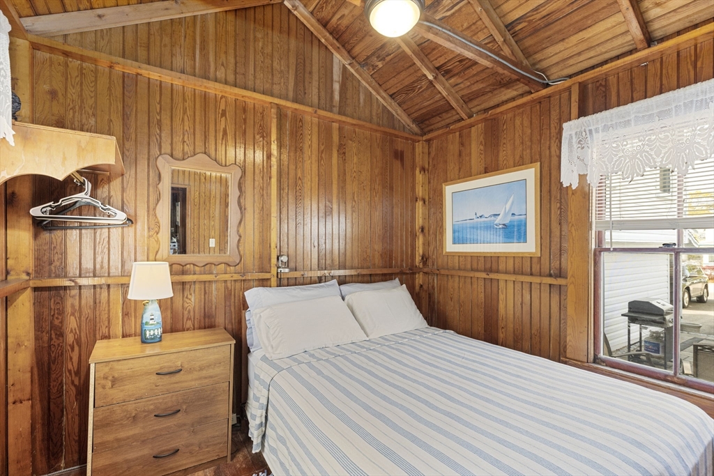 13 6th Street Wareham, MA 02558 - Photo 15 of 23 a bedroom with a bed and a table