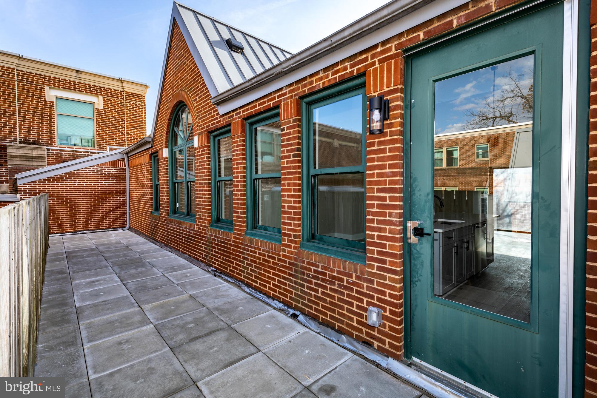3325 M Street Northwest, Unit TWO Washington, DC 20007 - Photo 6 of 33 a view of a house with a porch