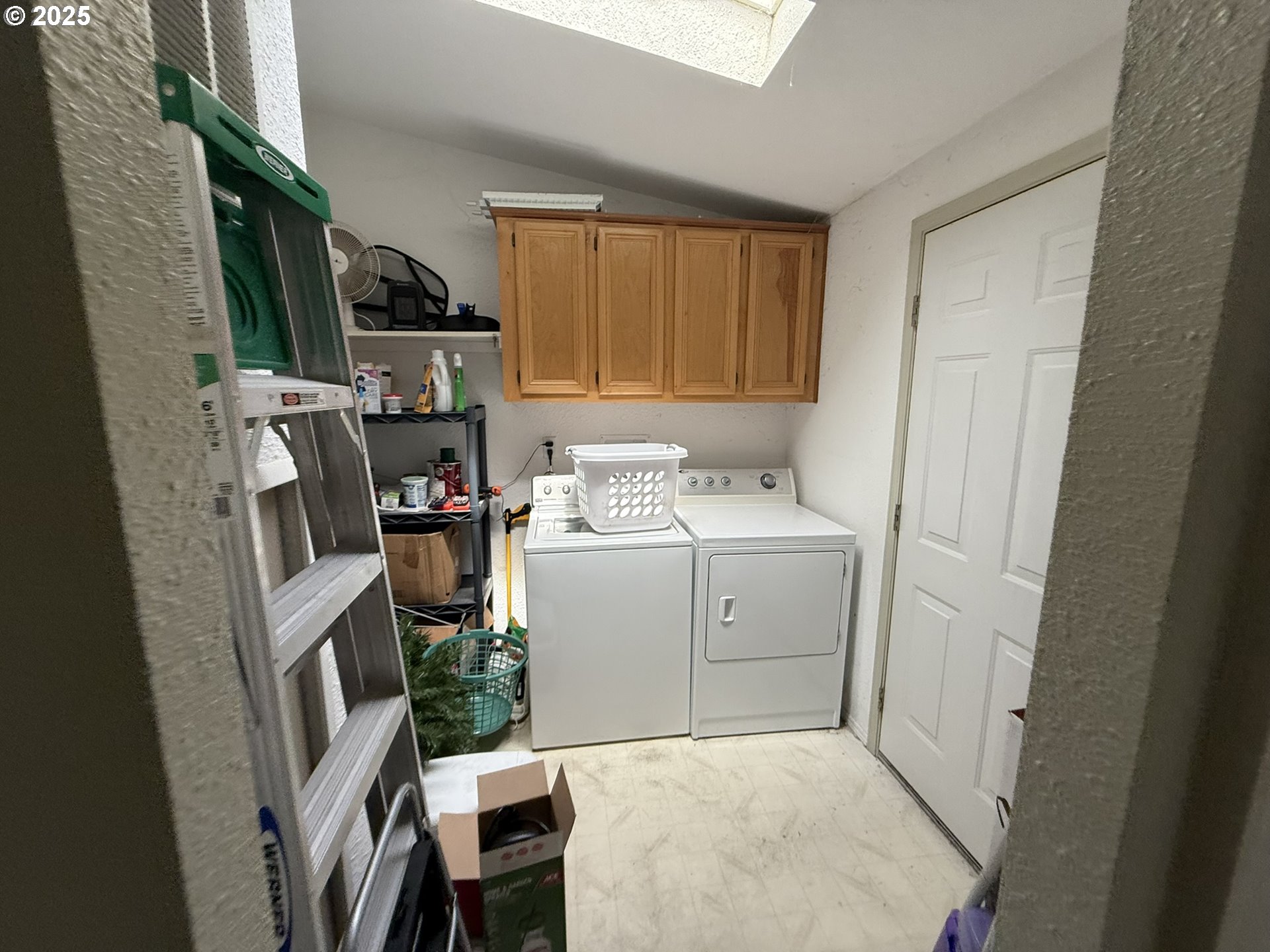 100 River Bend Road, Unit 74 Reedsport, OR 97467 - Photo 11 of 22 a utility room with cabinets washer and dryer
