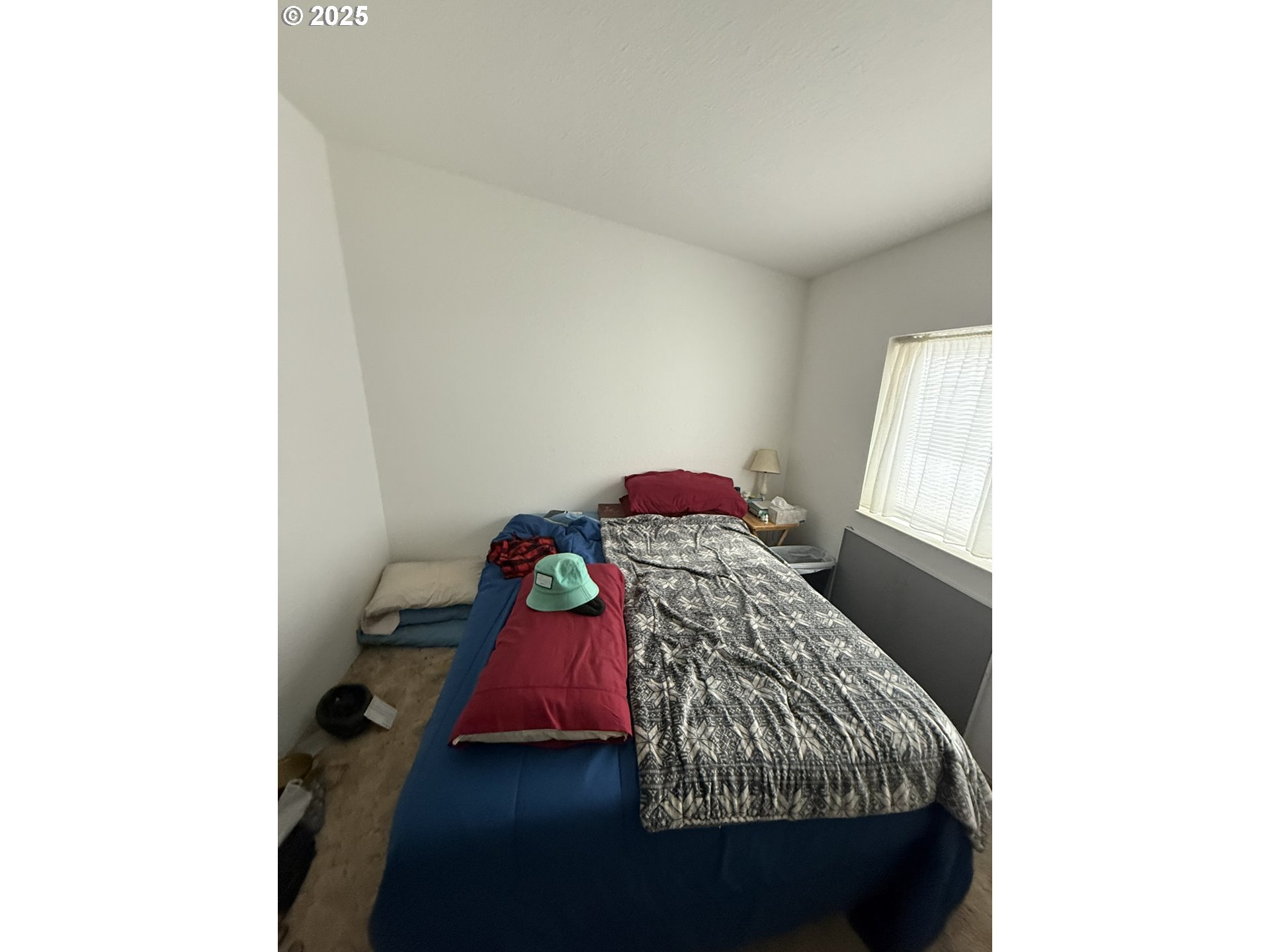 100 River Bend Road, Unit 74 Reedsport, OR 97467 - Photo 14 of 22 a bedroom with a bed and a window