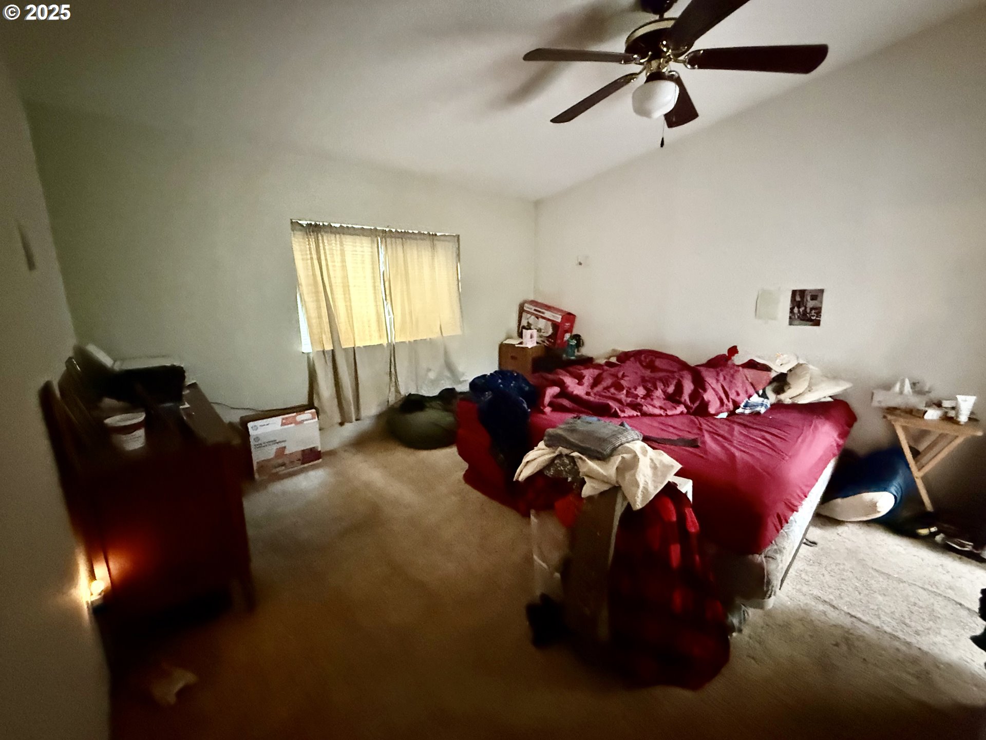 100 River Bend Road, Unit 74 Reedsport, OR 97467 - Photo 15 of 22 a bed room with a bed and a chandelier