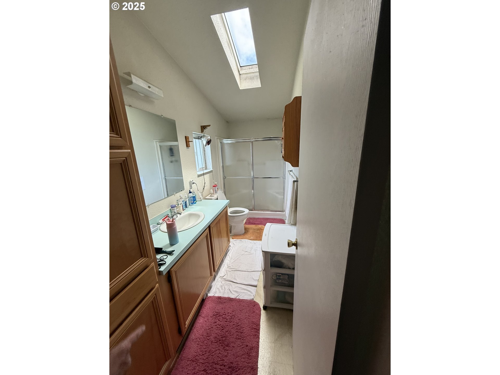 100 River Bend Road, Unit 74 Reedsport, OR 97467 - Photo 16 of 22 a kitchen with a sink and wooden floor