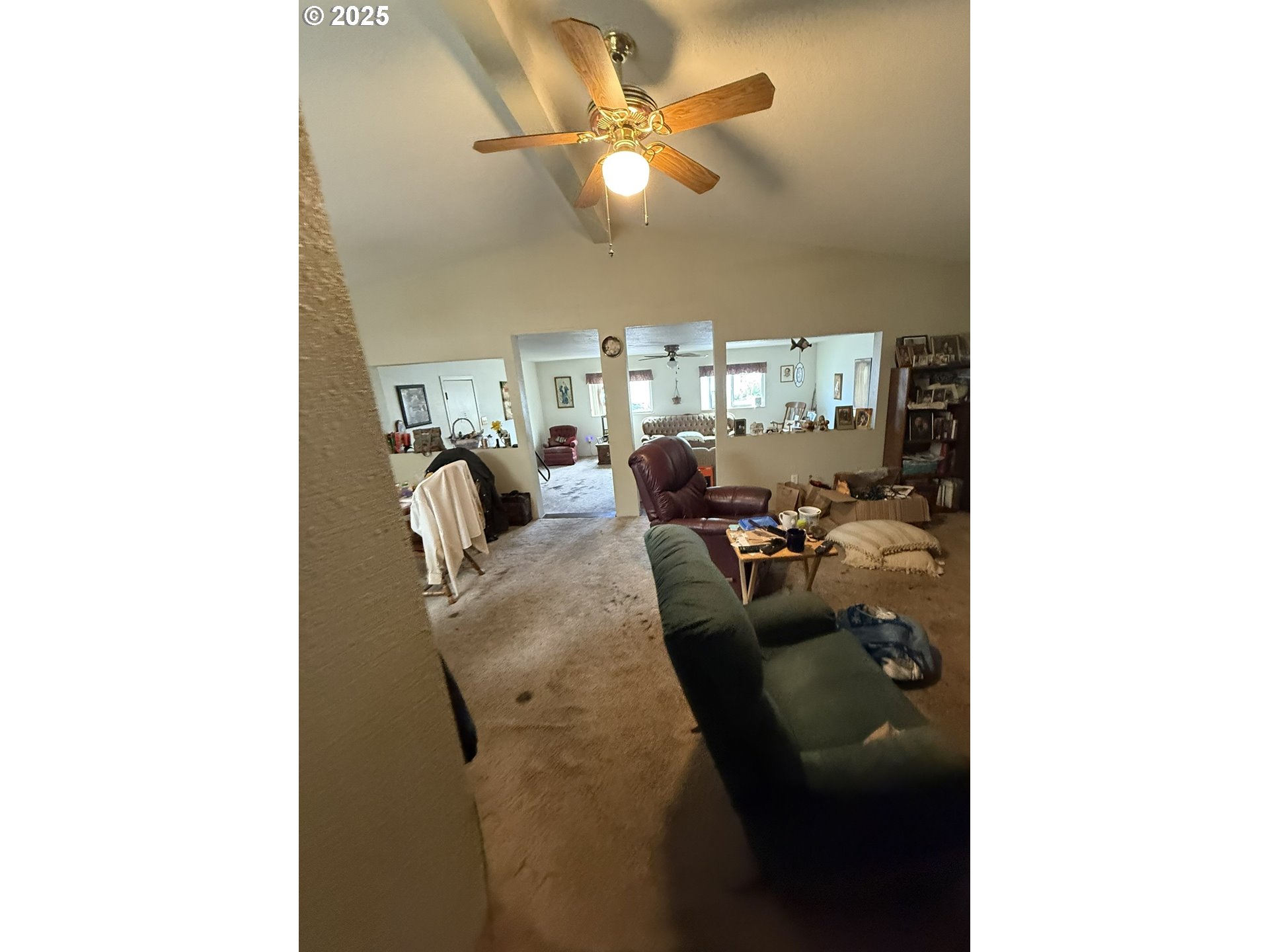 100 River Bend Road, Unit 74 Reedsport, OR 97467 - Photo 19 of 22 a living room with furniture and a chandelier