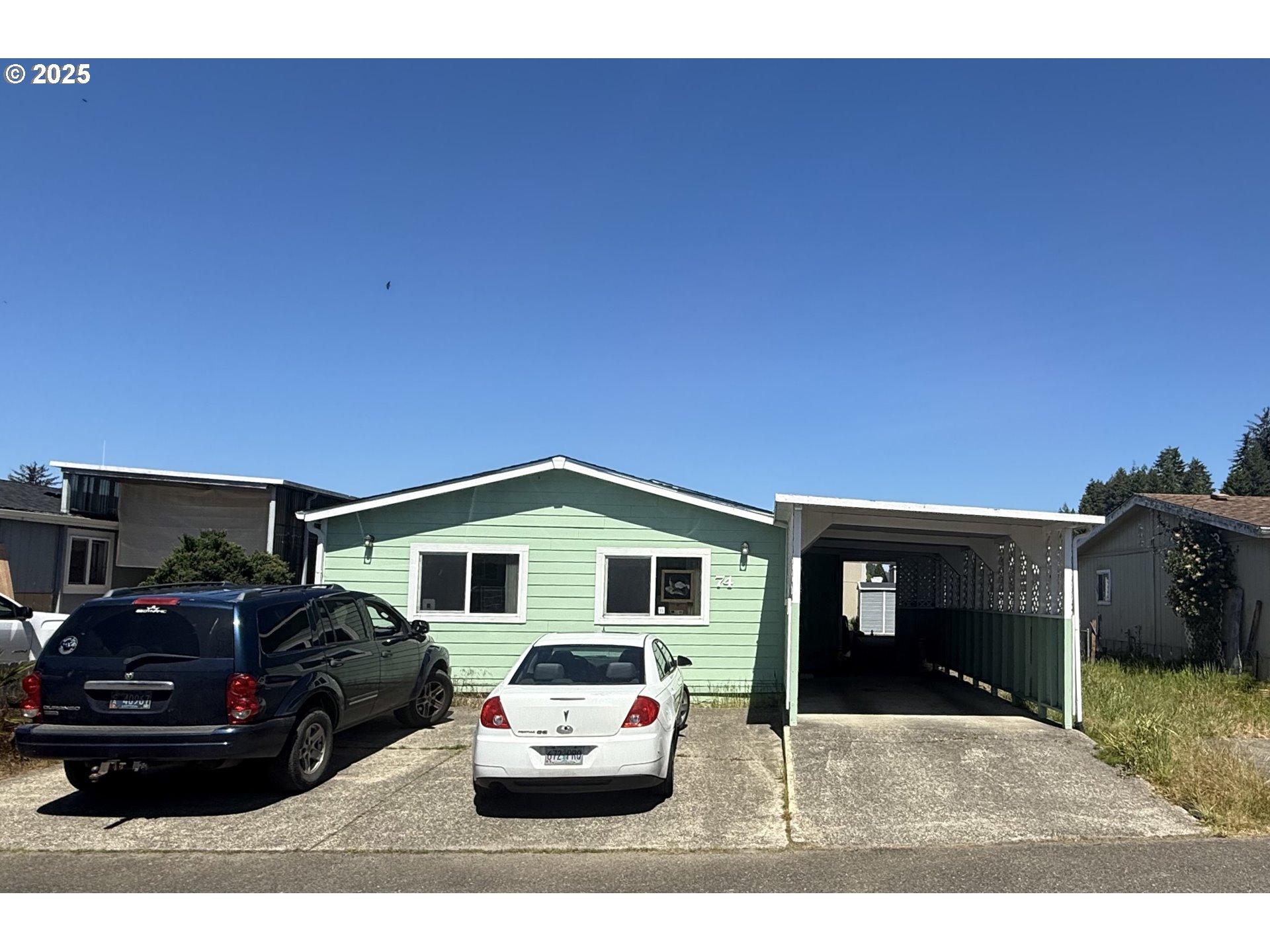 100 River Bend Road, Unit 74 Reedsport, OR 97467 - Photo 3 of 22 a house view with a outdoor space