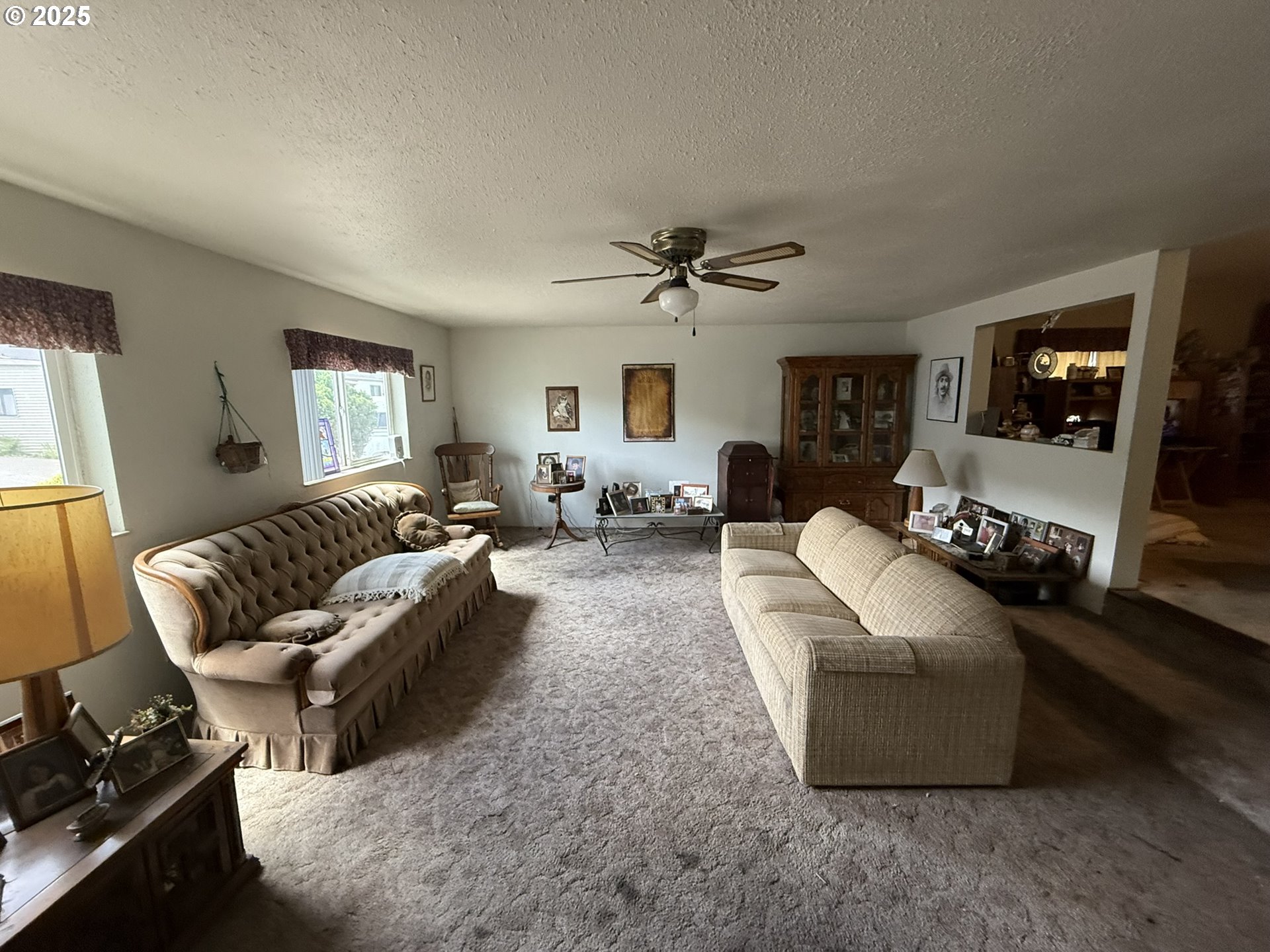 100 River Bend Road, Unit 74 Reedsport, OR 97467 - Photo 5 of 22 a living room with furniture and a flat screen tv