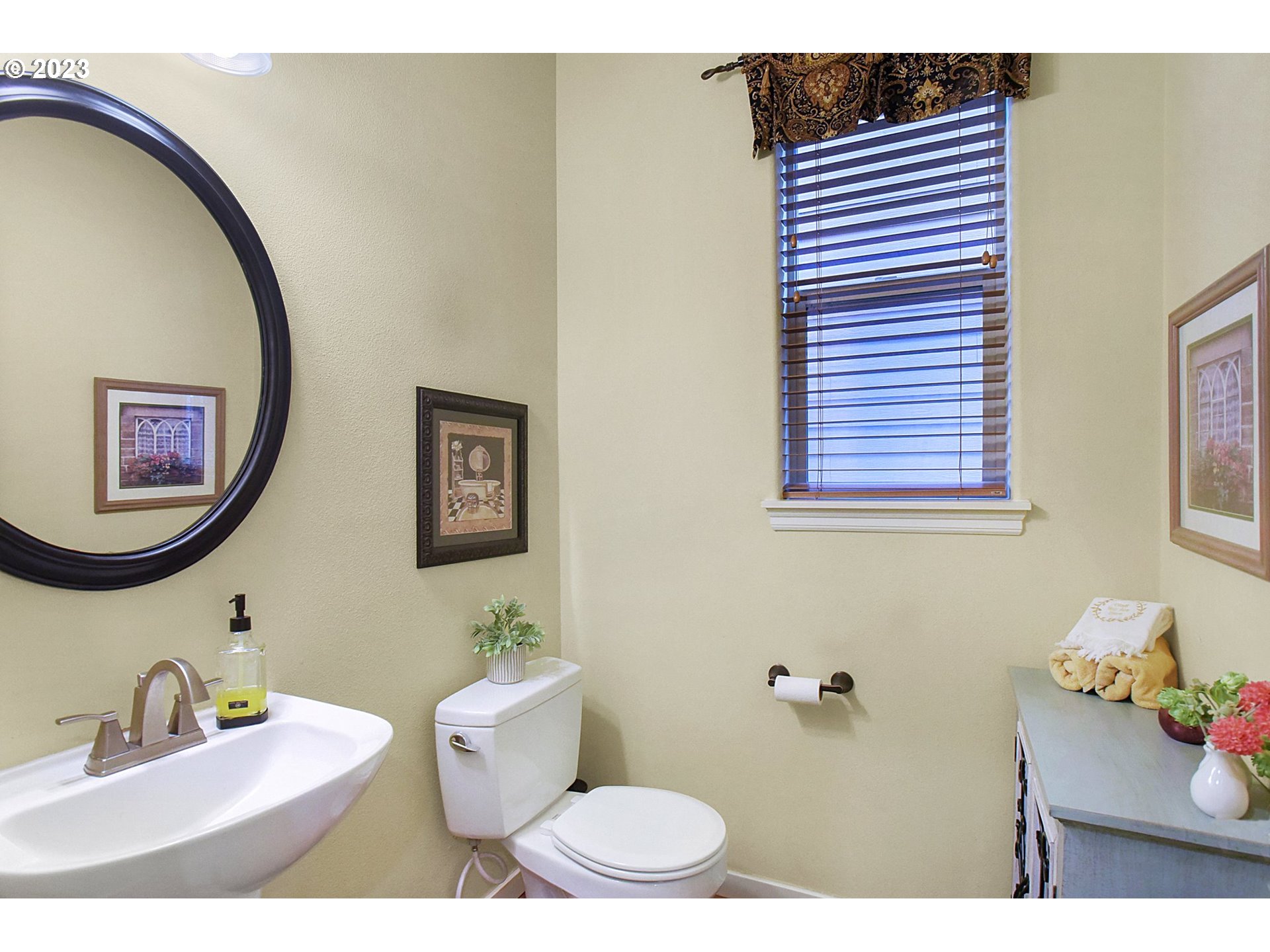 7826 Southwest Alder Street Tigard, OR 97224 - Photo 14 of 30 a bathroom with a sink mirror and toilet