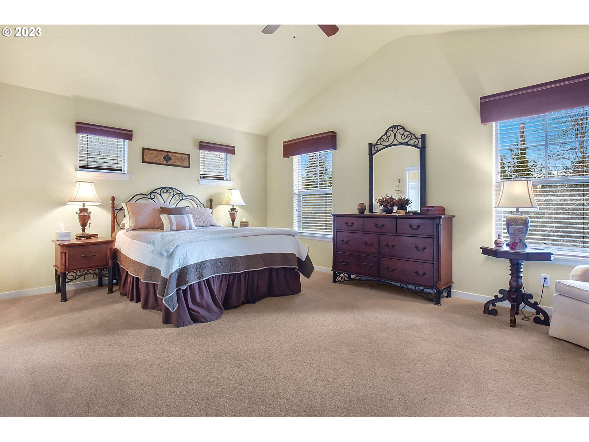 7826 Southwest Alder Street Tigard, OR 97224 - Photo 16 of 30 a bedroom with a bed and a table