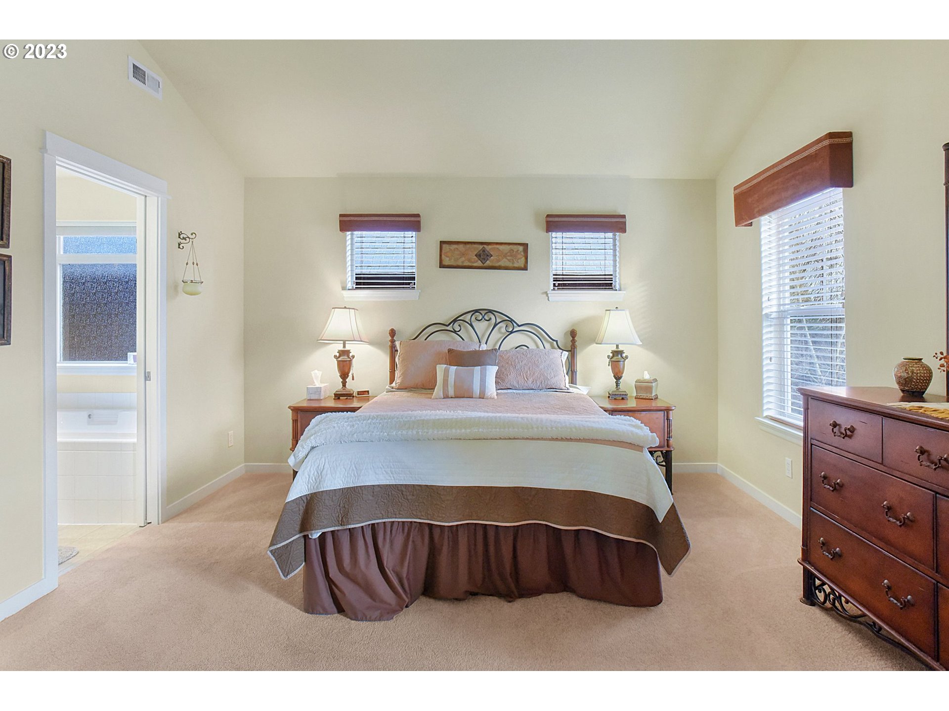 7826 Southwest Alder Street Tigard, OR 97224 - Photo 17 of 30 a bedroom with a bed and window