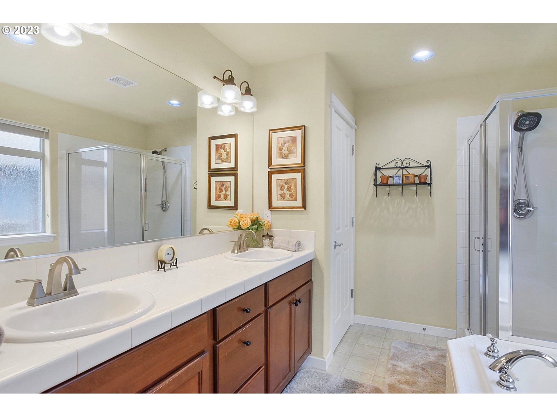 7826 Southwest Alder Street Tigard, OR 97224 - Photo 19 of 30 a bathroom with a double vanity sink and mirror