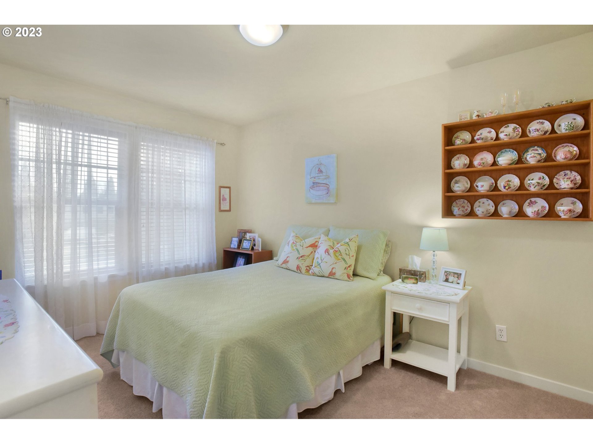 7826 Southwest Alder Street Tigard, OR 97224 - Photo 21 of 30 a bedroom with a bed and a table in it