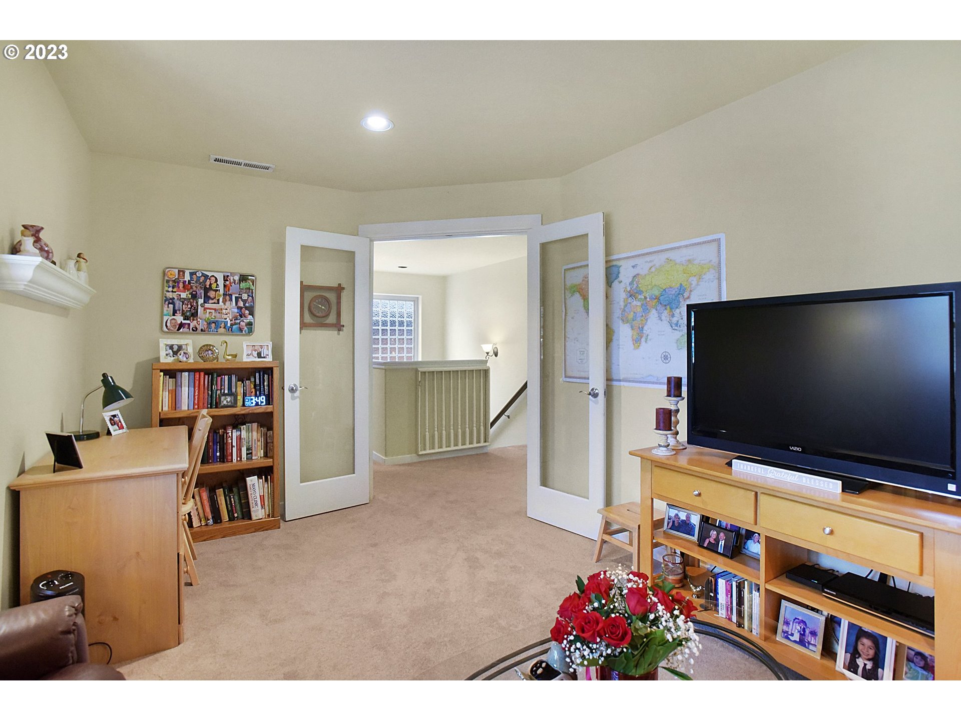 7826 Southwest Alder Street Tigard, OR 97224 - Photo 23 of 30 a living room with furniture and a flat screen tv