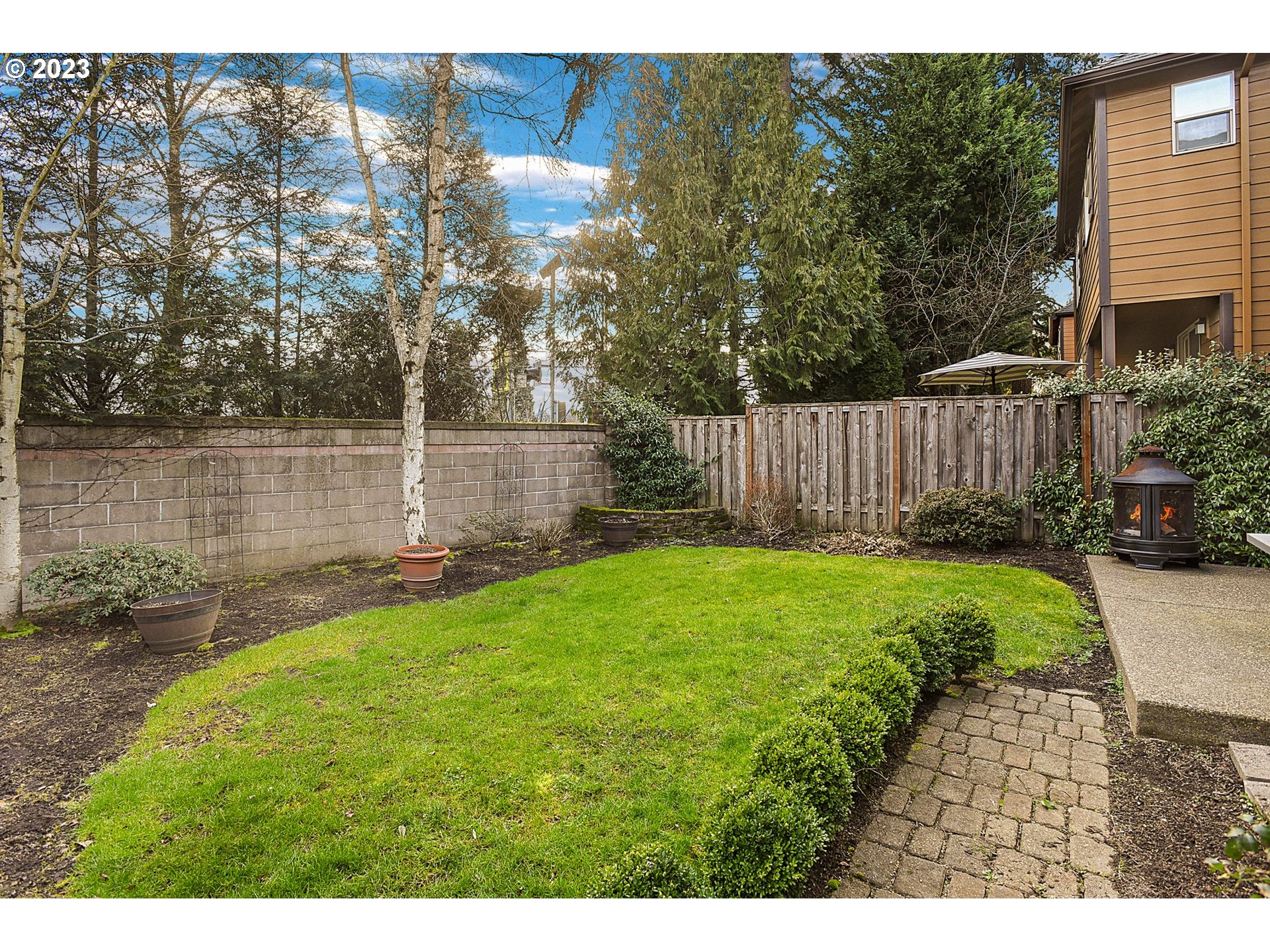 7826 Southwest Alder Street Tigard, OR 97224 - Photo 29 of 30 a view of a backyard with a garden