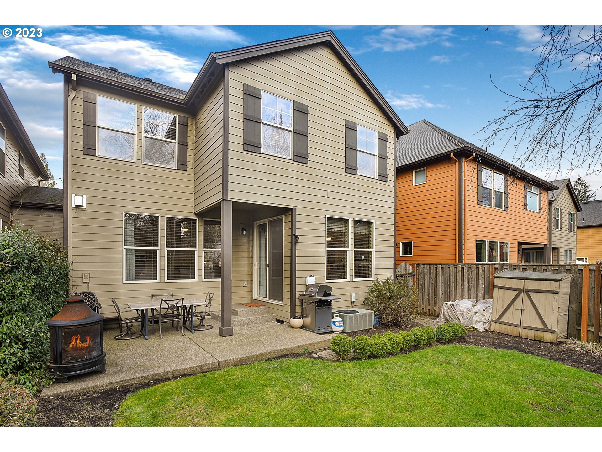 7826 Southwest Alder Street Tigard, OR 97224 - Photo 30 of 30 a view of a house with a yard and sitting area