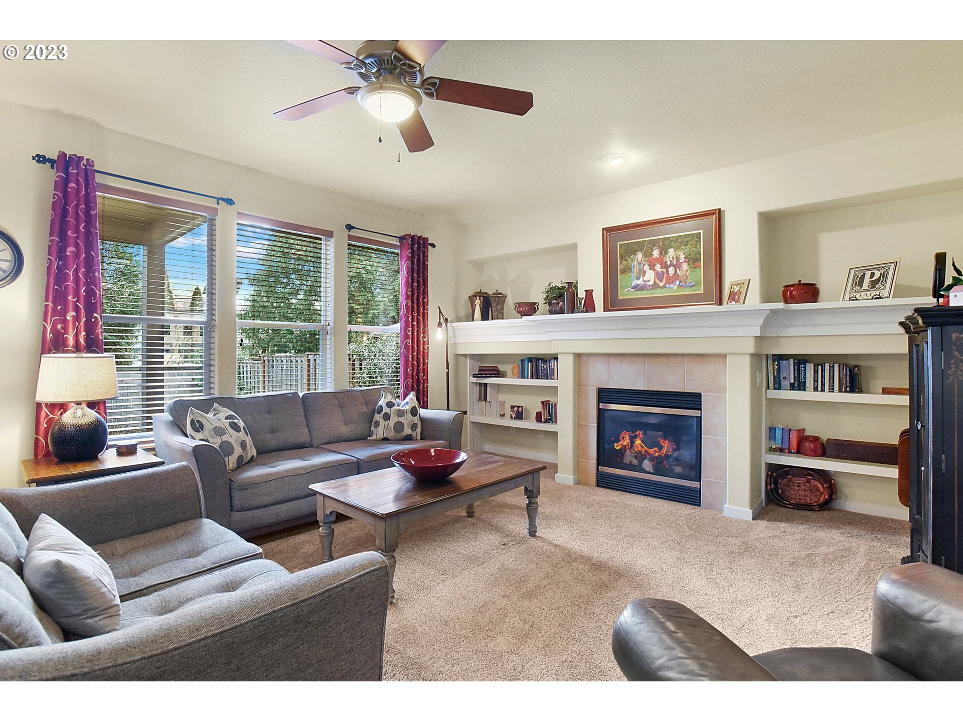 7826 Southwest Alder Street Tigard, OR 97224 - Photo 6 of 30 a living room with furniture and a fireplace