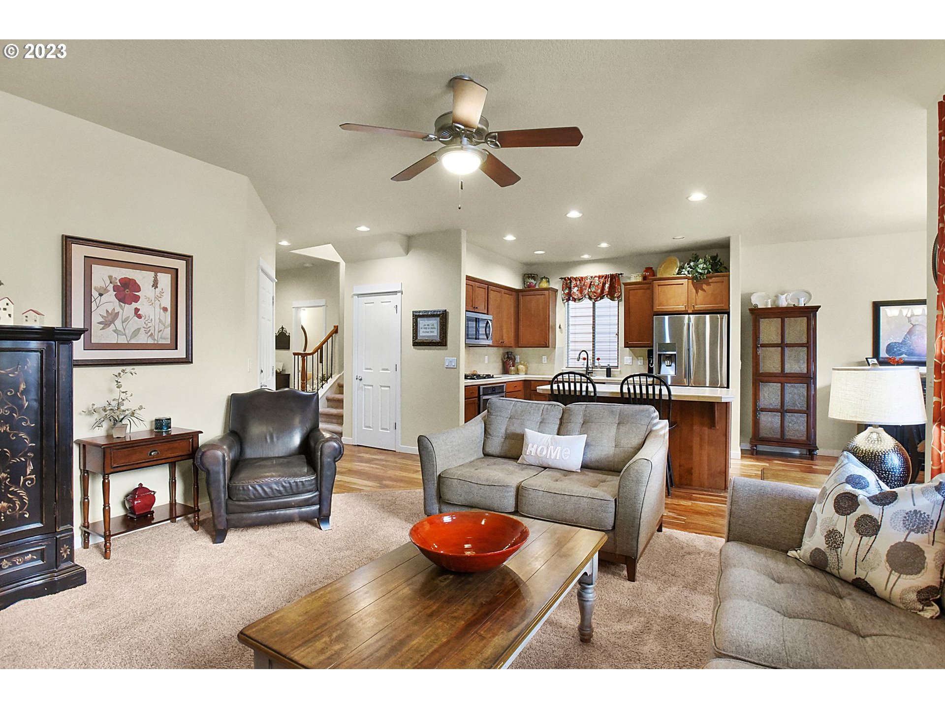 7826 Southwest Alder Street Tigard, OR 97224 - Photo 8 of 30 a living room with furniture and kitchen view