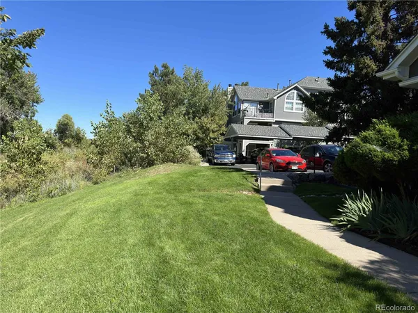 a view of a house with a yard