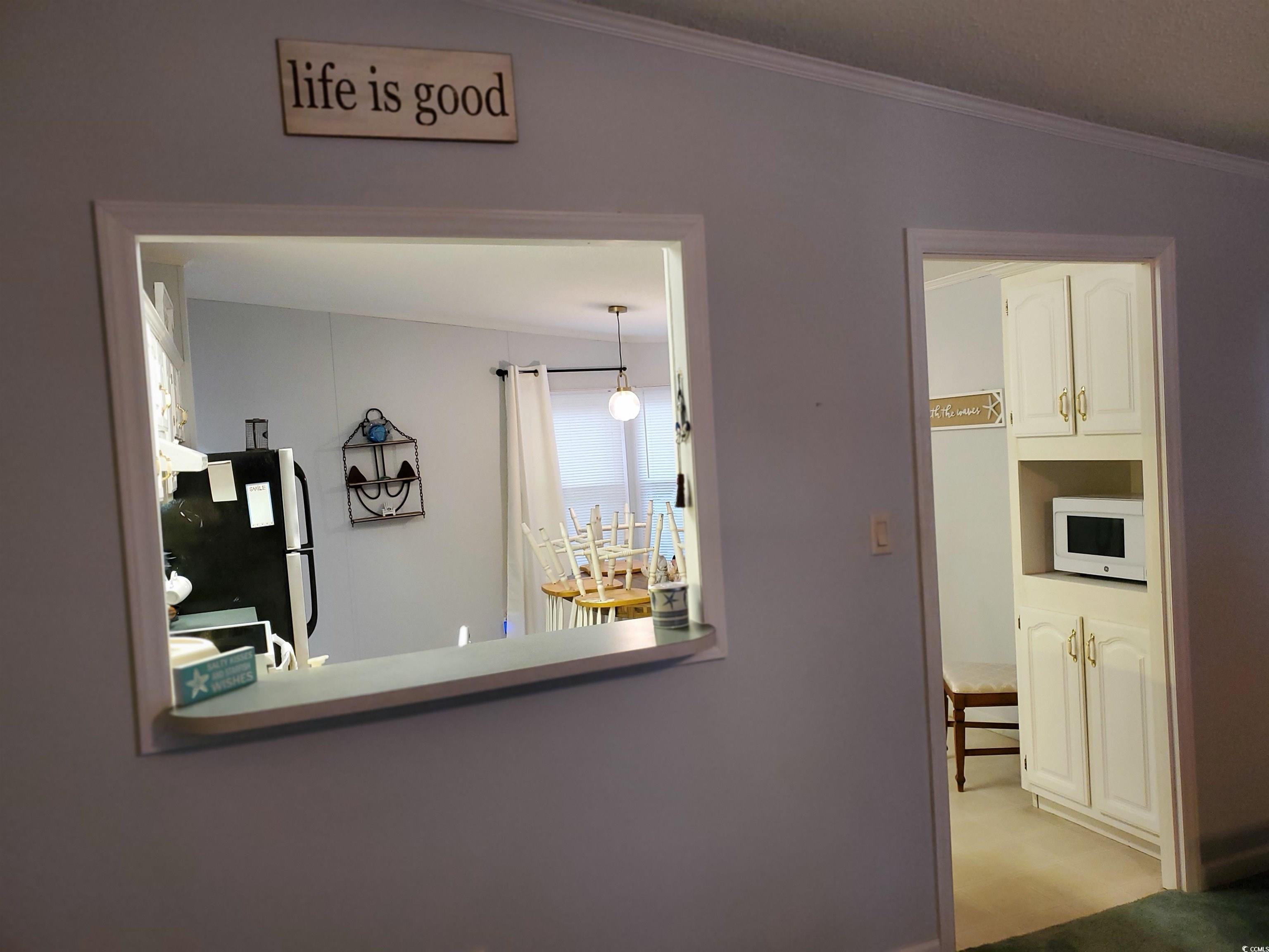 441 Delton Drive Murrells Inlet, SC 29576 - Photo 15 of 30 Hallway with ornamental molding and light colored carpet
