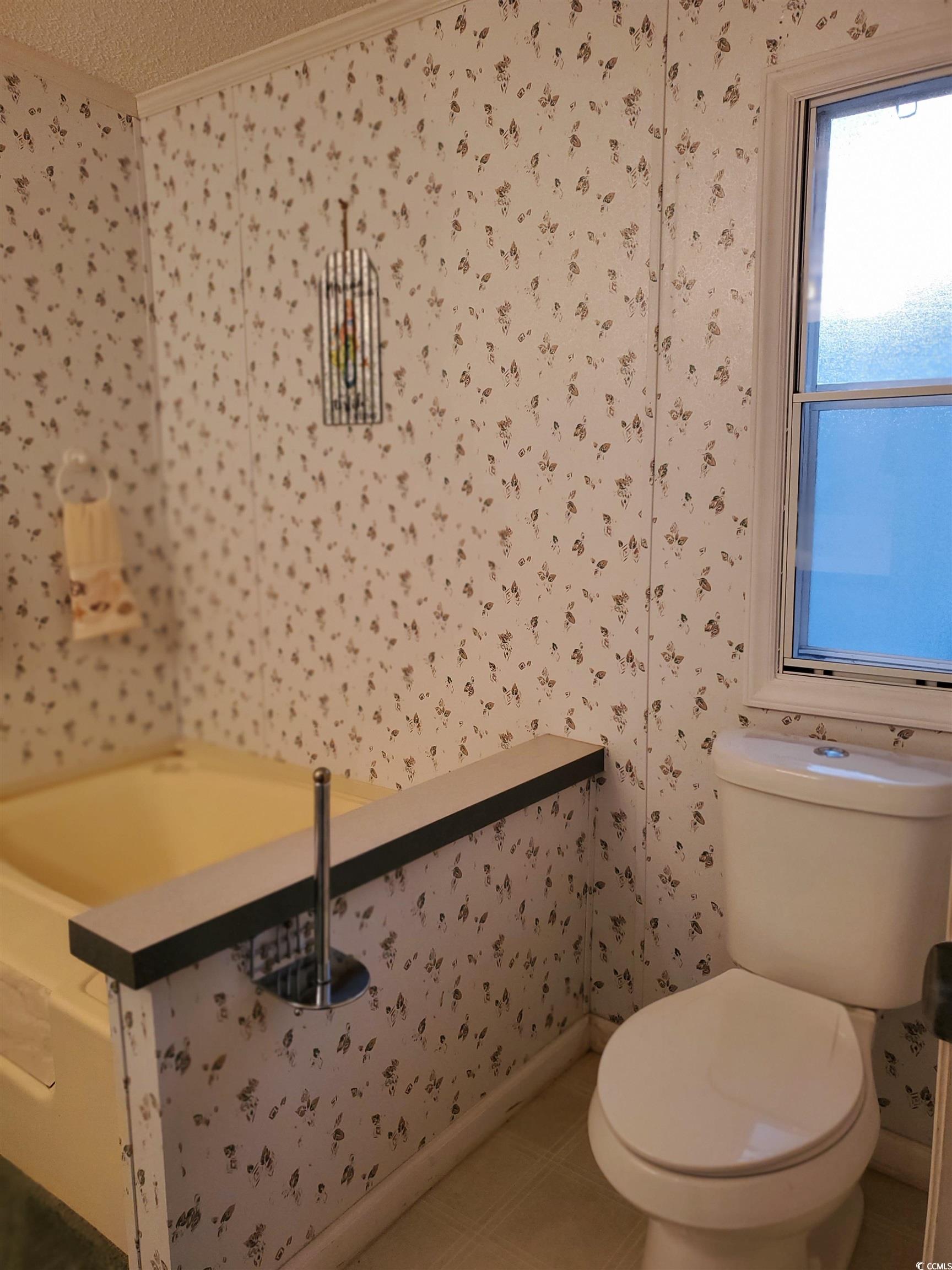 441 Delton Drive Murrells Inlet, SC 29576 - Photo 24 of 30 Bathroom with ornamental molding, toilet, and tile patterned flooring