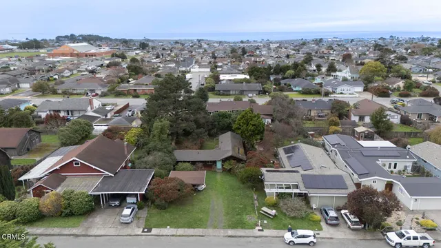 an aerial view of residential houses with outdoor space