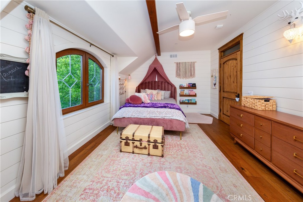 85 Saddlebow Road Bell Canyon, CA 91307 - Photo 49 of 75 a living room with a bed furniture and a large window
