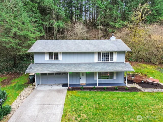 a view of house with yard