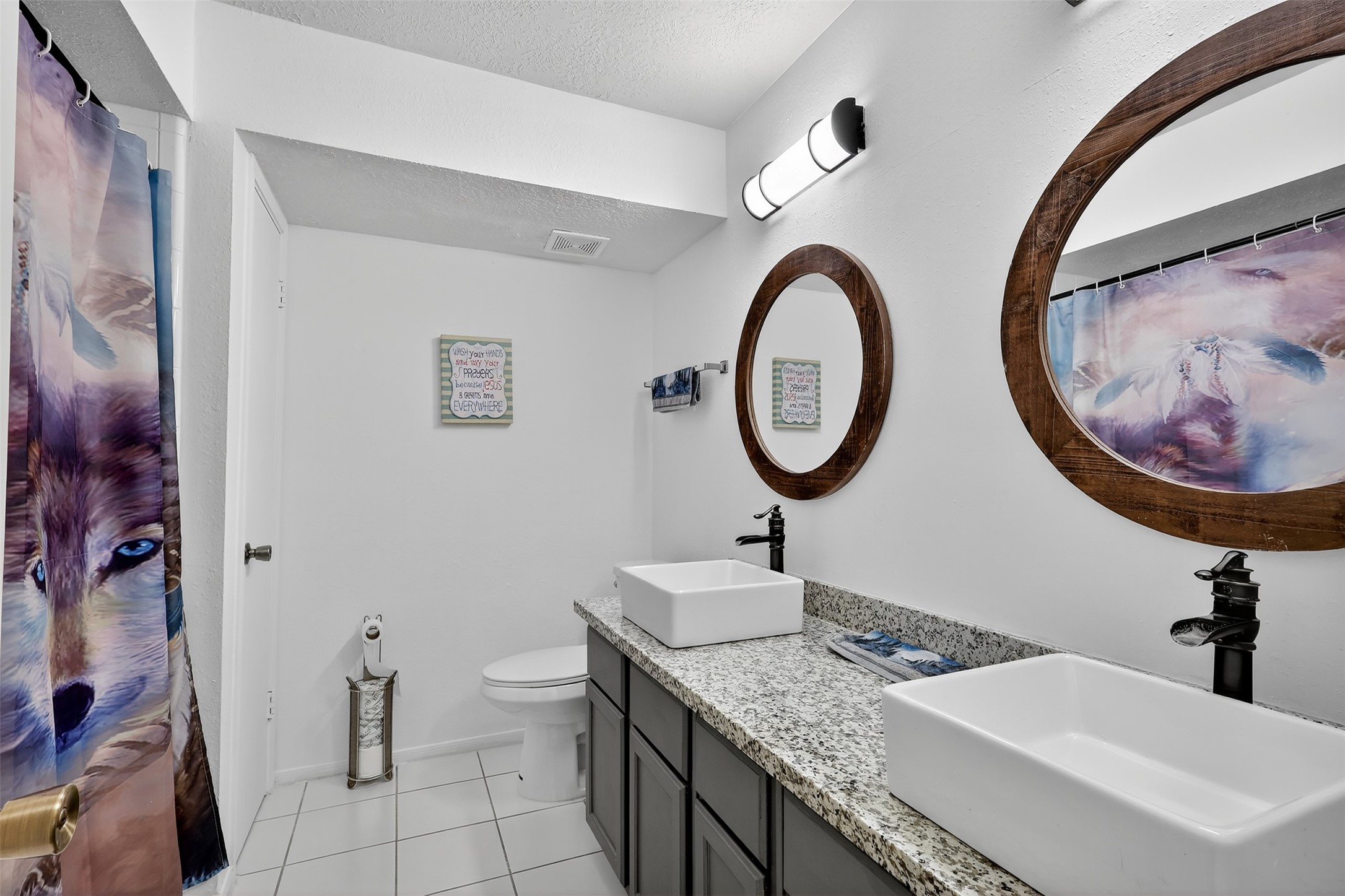 3402 Crystal Dove Drive Spring, TX 77388 - Photo 23 of 33 a bathroom with a granite countertop toilet a sink and a mirror