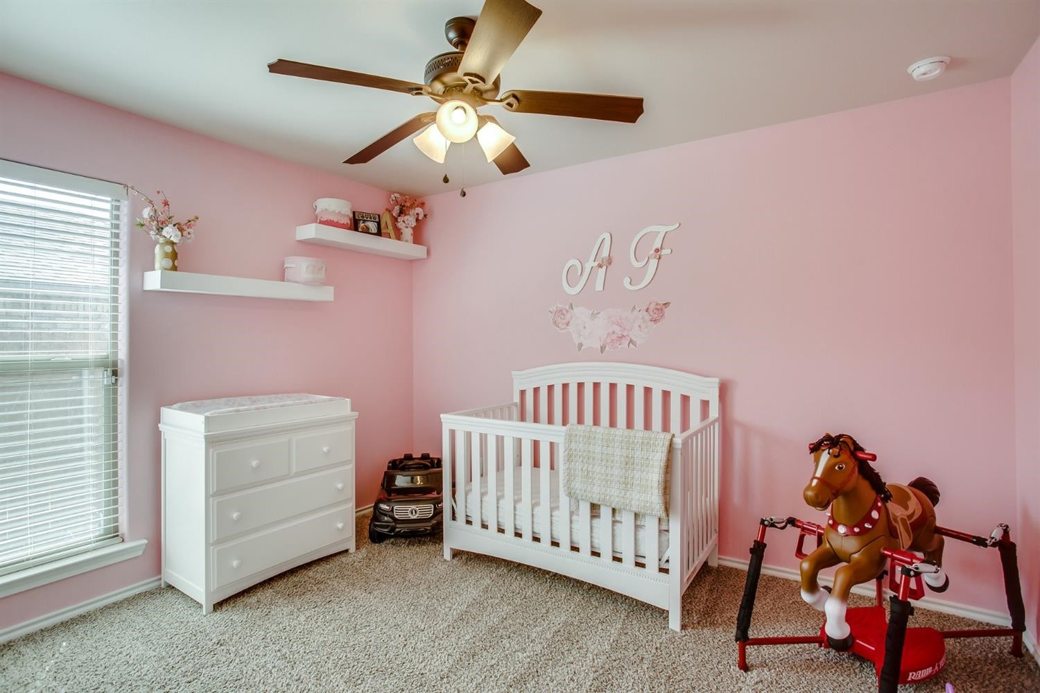 7449 104th Street Lubbock, TX 79424 - Photo 11 of 16 a bedroom with furniture and a window