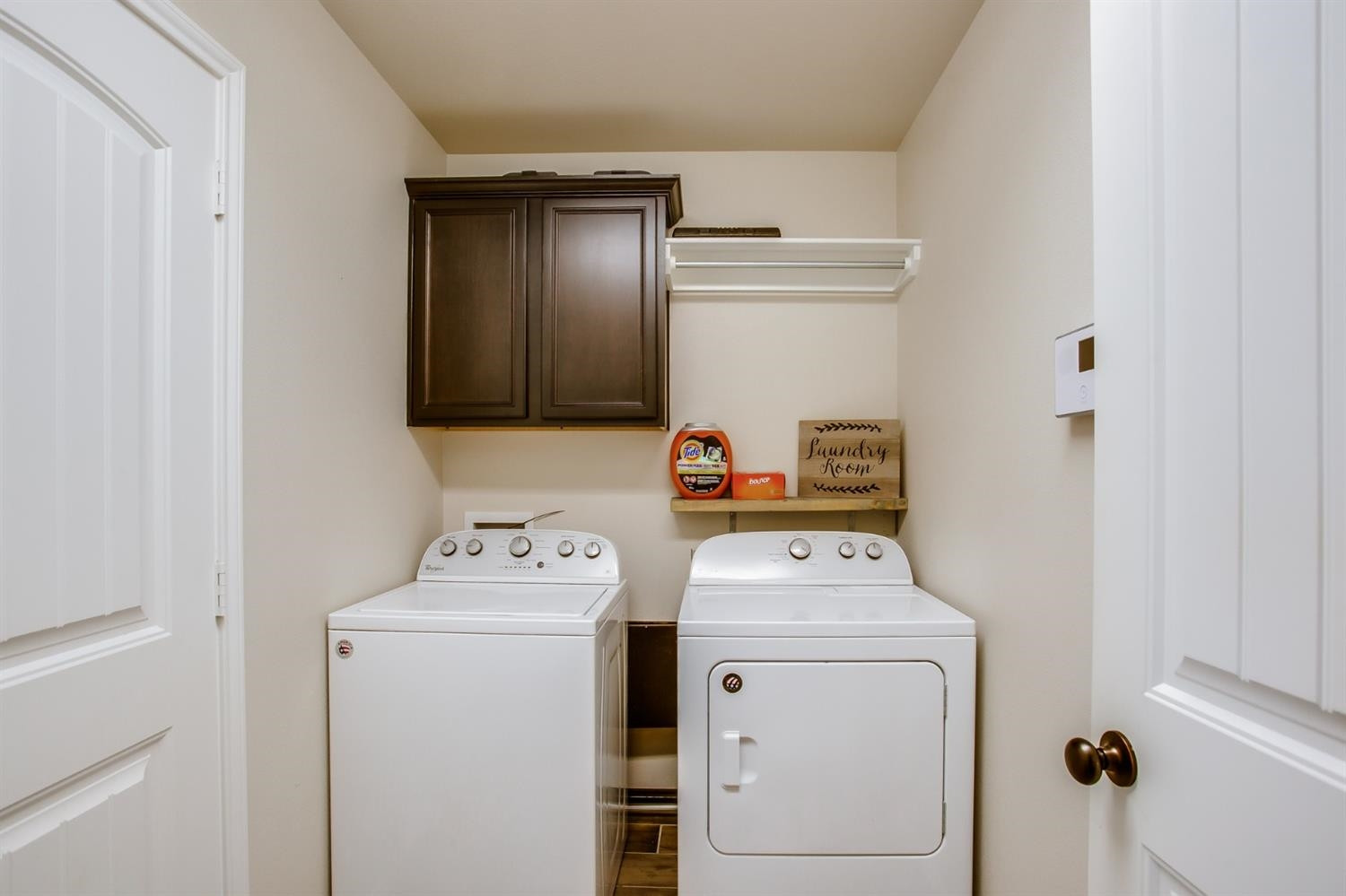 7449 104th Street Lubbock, TX 79424 - Photo 14 of 16 a utility room with dryer and washer