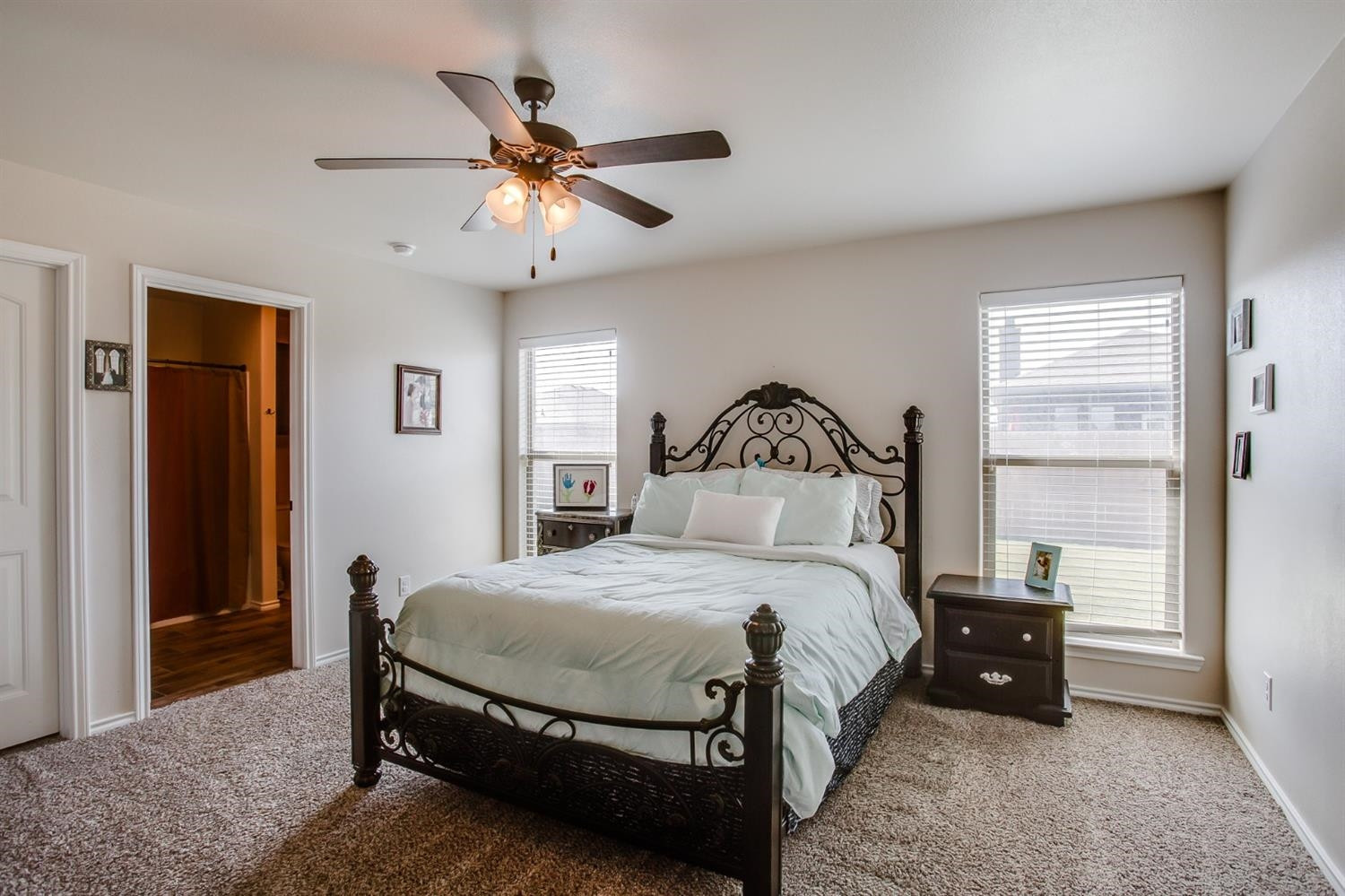 7449 104th Street Lubbock, TX 79424 - Photo 8 of 16 a bedroom with a bed and window