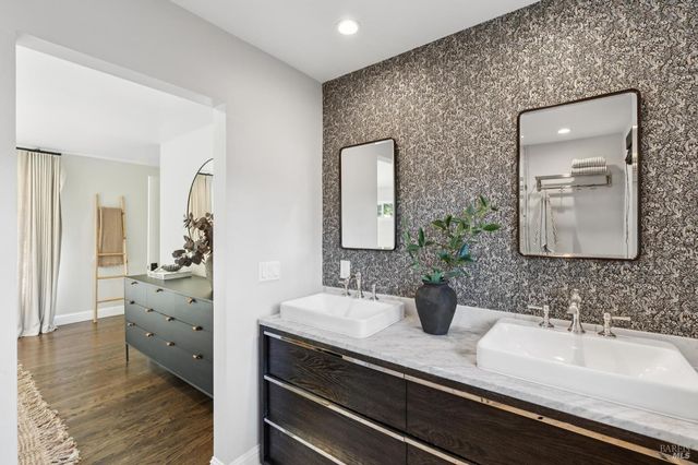 a bathroom with a sink and a mirror