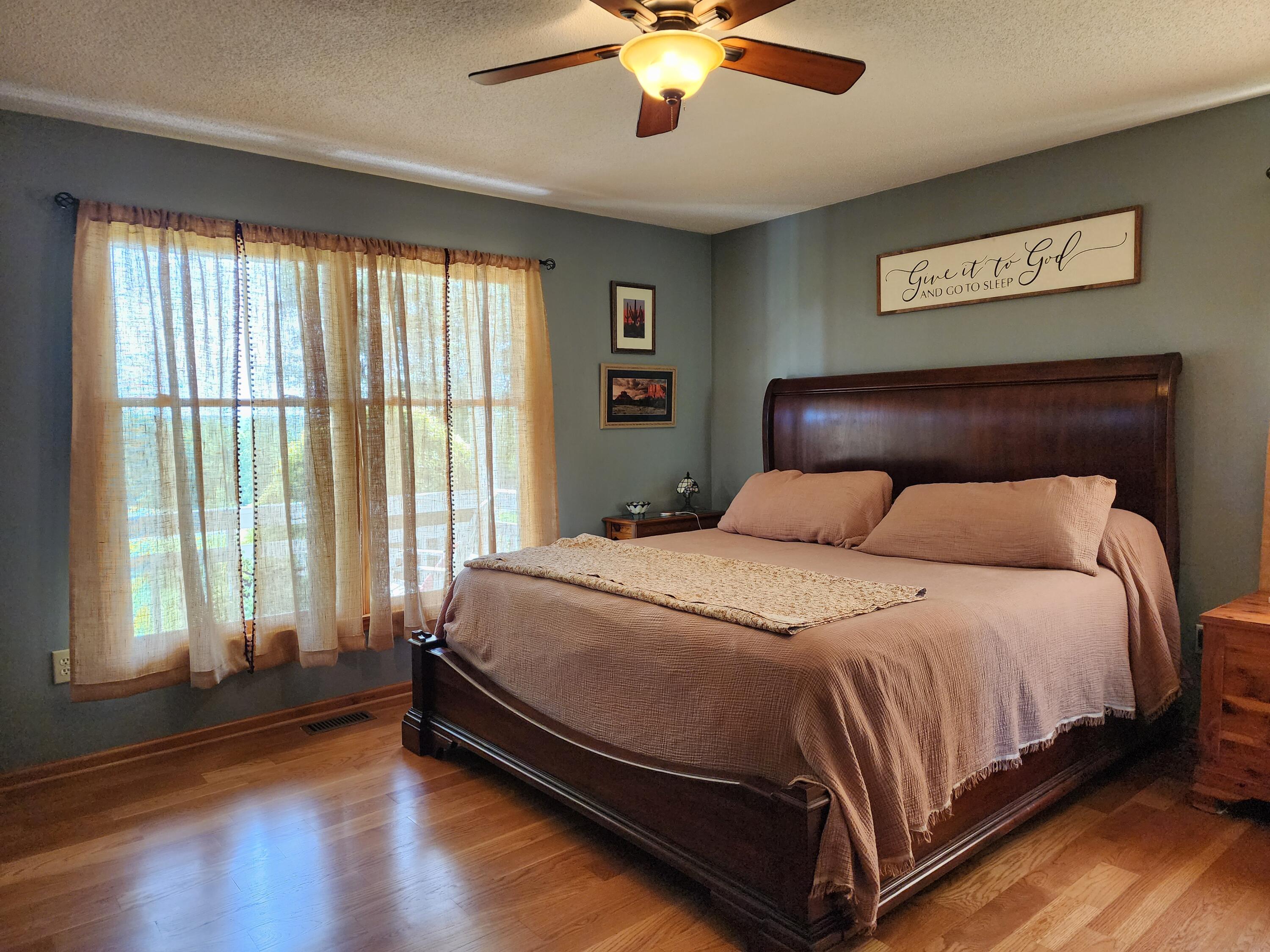 1199 Muse Field Road Rocky Mount, VA 24151 - Photo 19 of 41 a large bed sitting in a bedroom next to a window