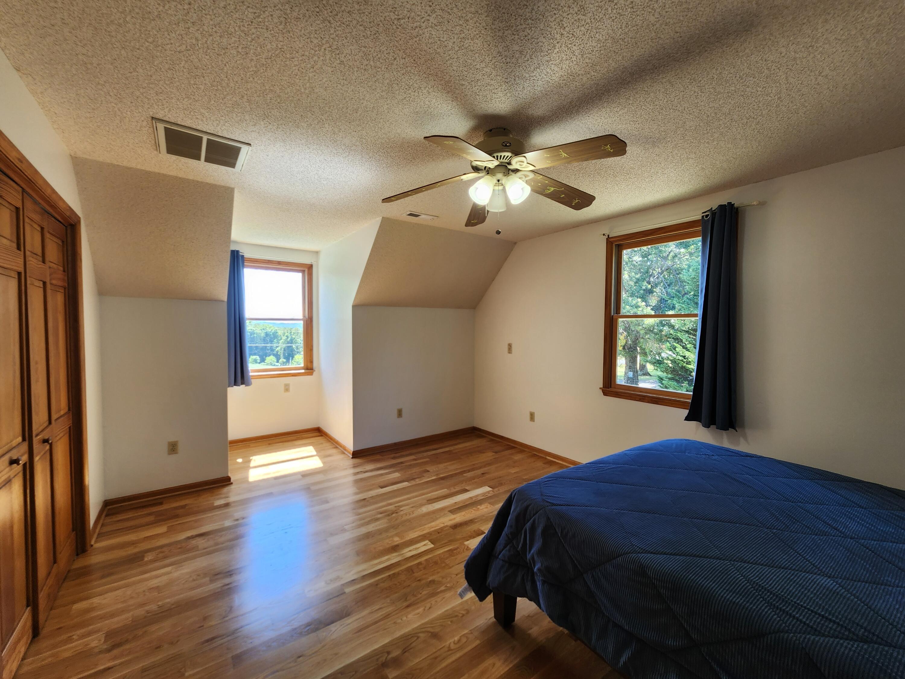1199 Muse Field Road Rocky Mount, VA 24151 - Photo 23 of 41 a bedroom with a bed and a window