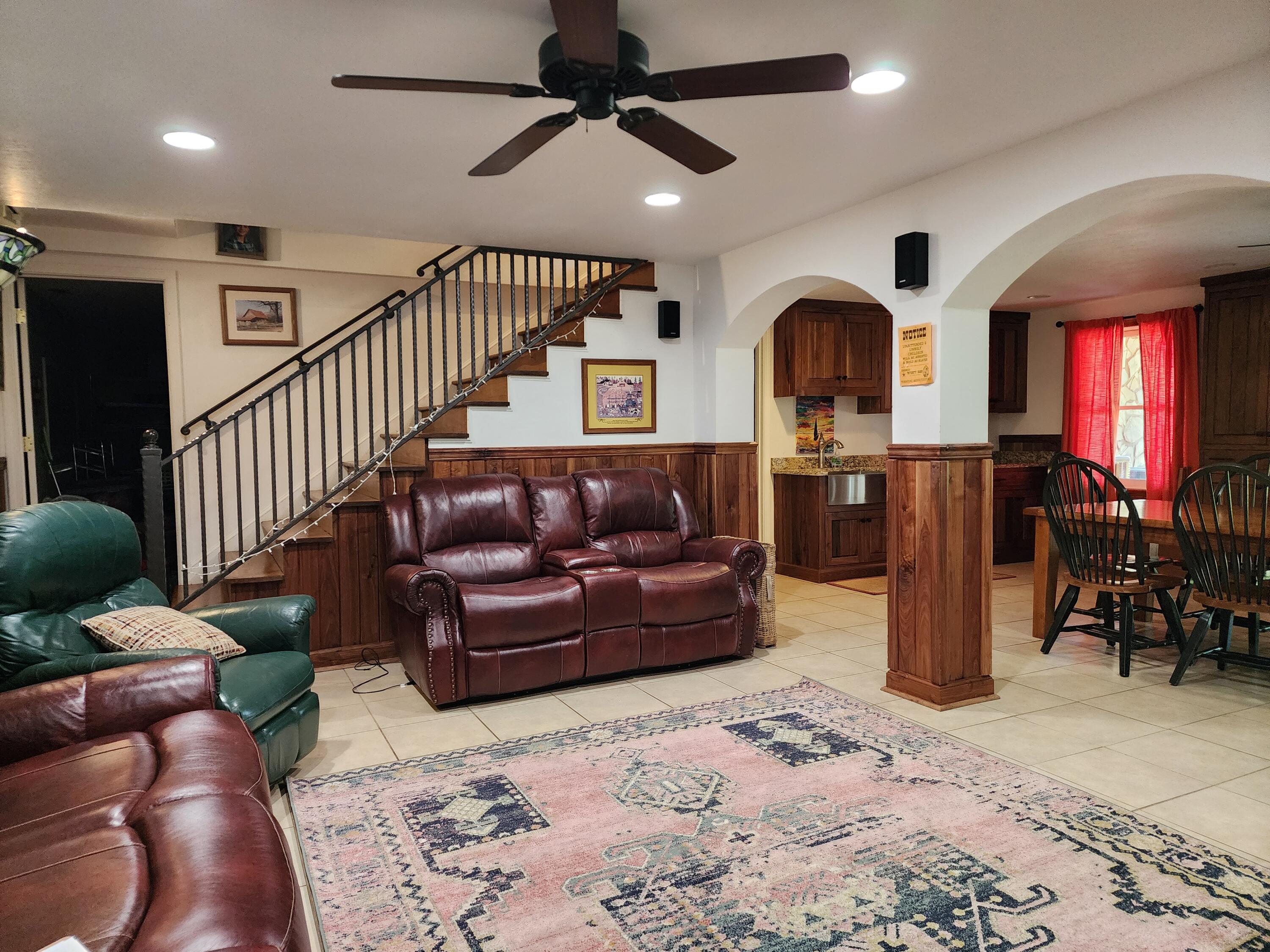 1199 Muse Field Road Rocky Mount, VA 24151 - Photo 33 of 41 a living room with furniture ceiling fan and a rug