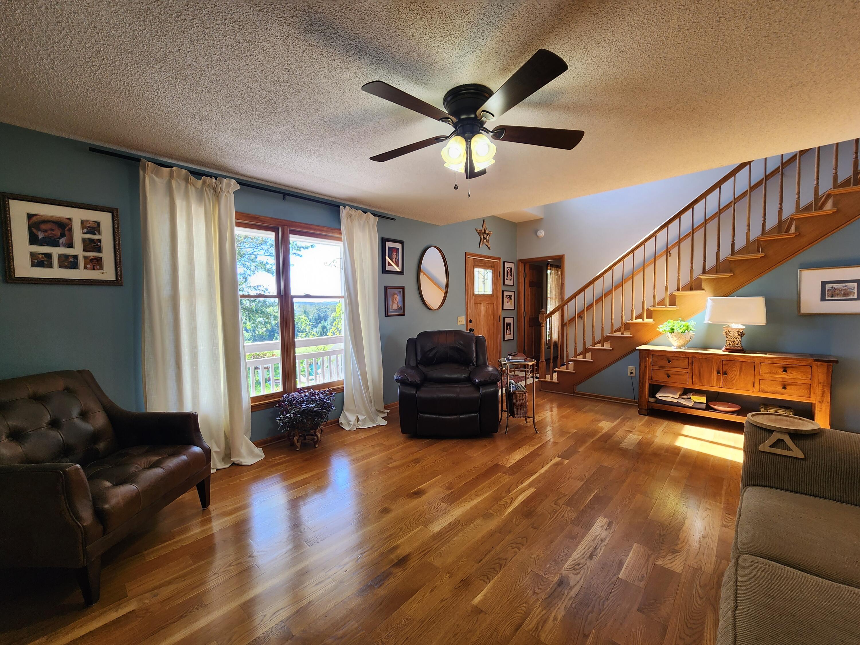 1199 Muse Field Road Rocky Mount, VA 24151 - Photo 8 of 41 a living room with furniture and a chandelier