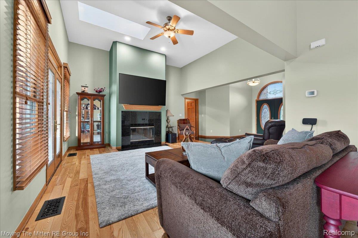 39750 Willow Road New Boston, MI 48164 - Photo 4 of 68 Vaulted ceiling with skylight and ceiling fan