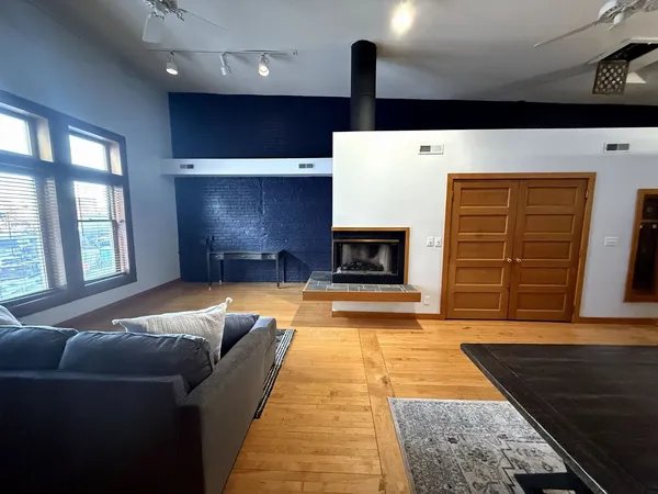 a bedroom with bed and a window