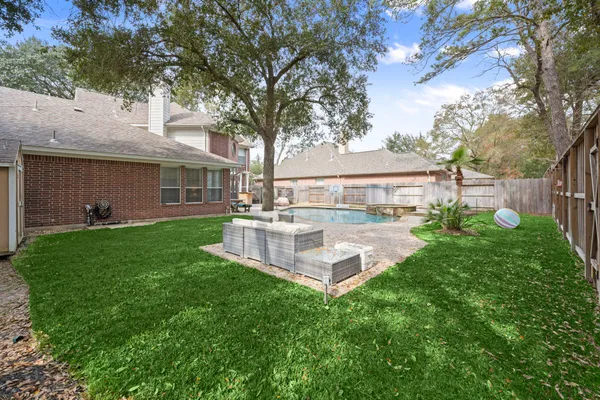 a view of a house with a yard porch and sitting area