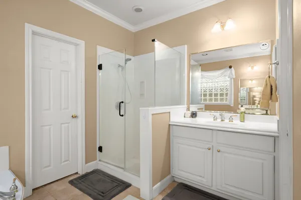 a bathroom with a double vanity sink and mirror