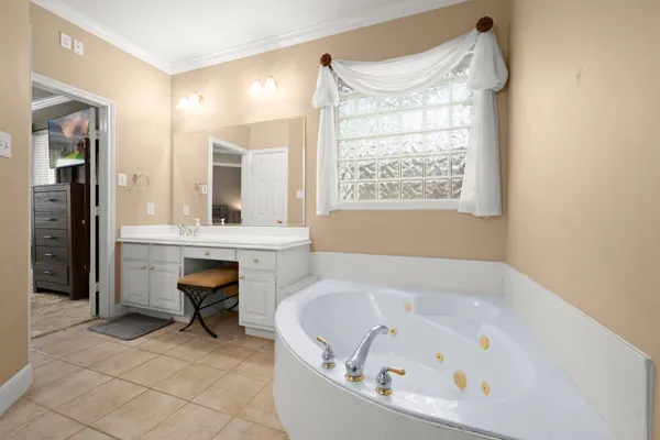 a bathroom with a bathtub and a sink