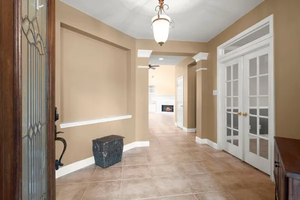 a bathroom with a tub shower and sink