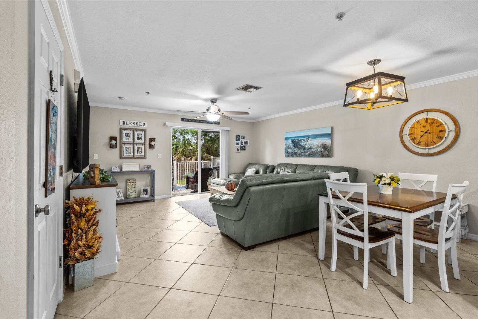 5290 Southeast Mitchell Lane Stuart, FL 34997 - Photo 4 of 43 a living room with furniture and a table