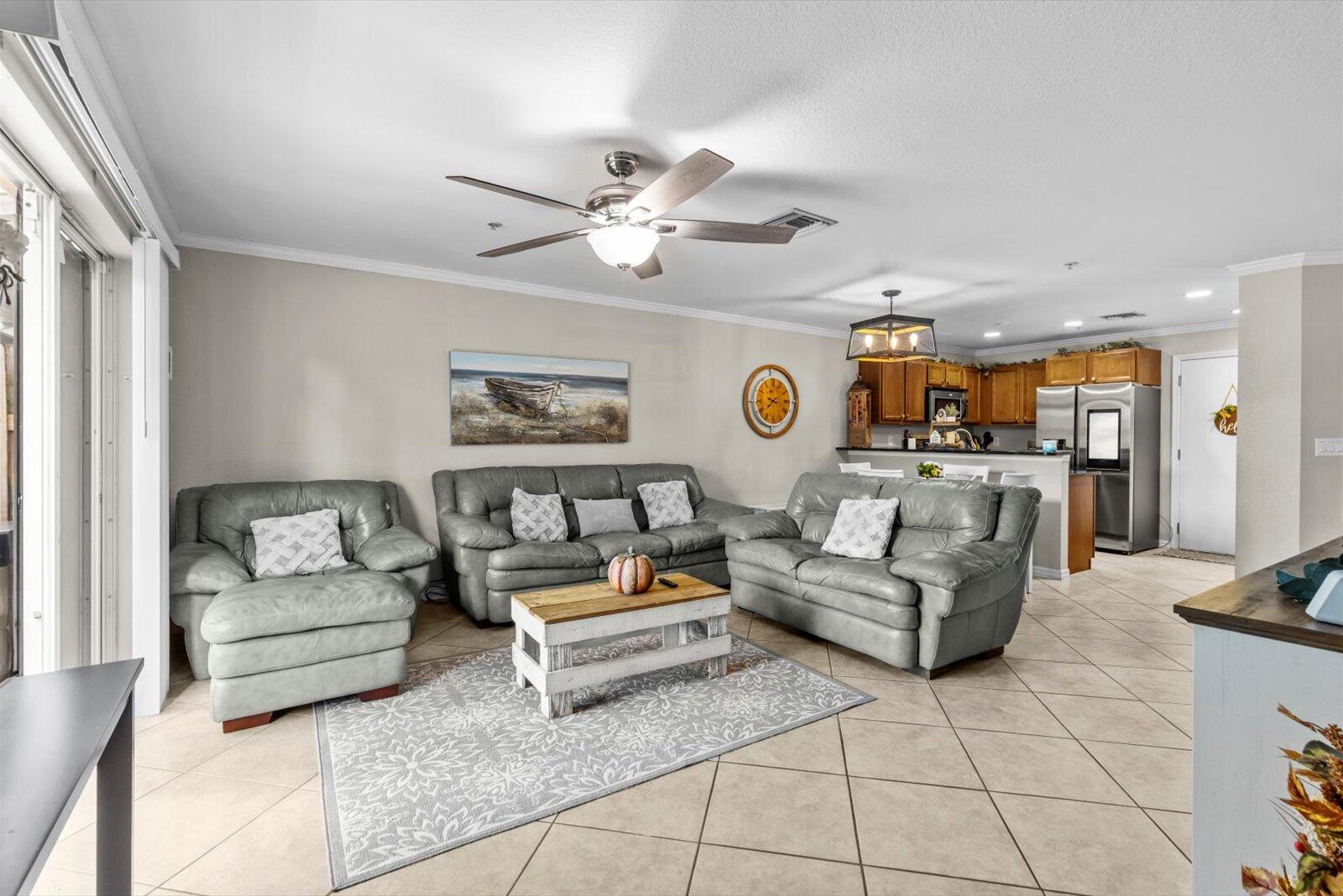 5290 Southeast Mitchell Lane Stuart, FL 34997 - Photo 6 of 43 a living room with furniture and kitchen view